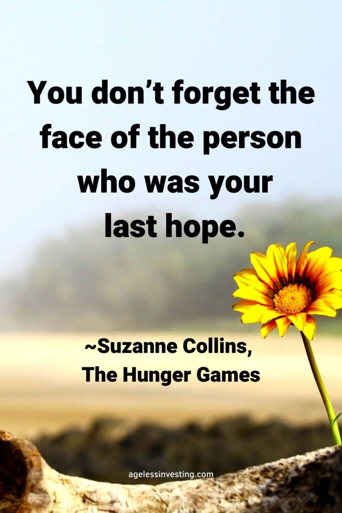 A picture of a yellow flower growing on the dry ground, with the quote “You don’t forget the face of the person who was your last hope.” ― Suzanne Collins, The Hunger Games