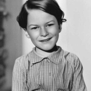 An image of Scout Finch from To Kill A Mockingbird in black and white