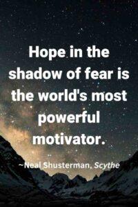 An image of a shadowy valley, at night, with the text overlay: “Hope in the shadow of fear is the world's most powerful motivator.” ~Neal Shusterman, Scythe